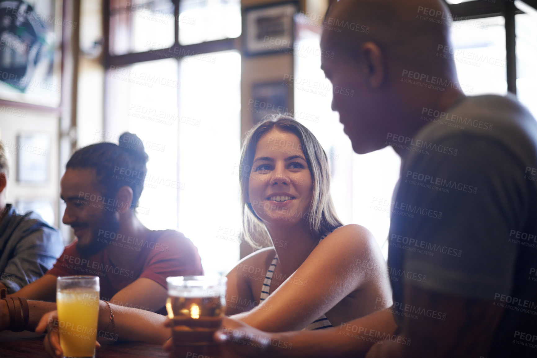 Buy stock photo Friends, woman or happiness in pub with beer for happy hour, relax or social event with conversation. Diversity, people or drinking alcohol in restaurant or club with smile for bonding or celebration