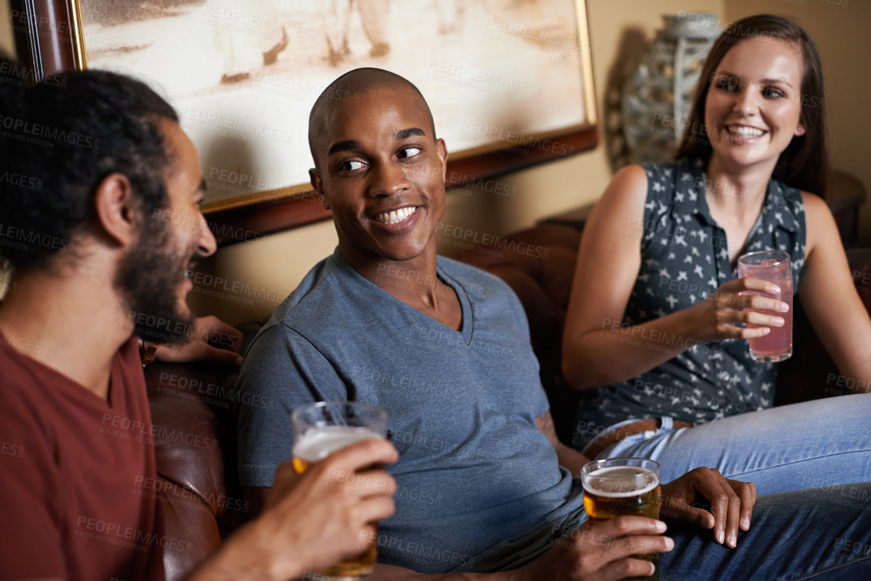 Buy stock photo Friends, beer and drinks at pub, smile and relax indoor for glass and bonding in summer to diverse. Male people, bar and chill for social, guys and alcohol together and laughing for fun and weekend.