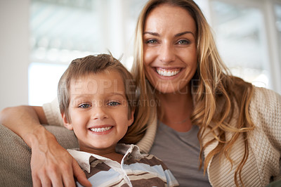 Buy stock photo Smile, portrait and mother with son to relax, love and bonding together on couch for holiday wellness. Happy family, care and face of woman with child and healthy for childhood development in home