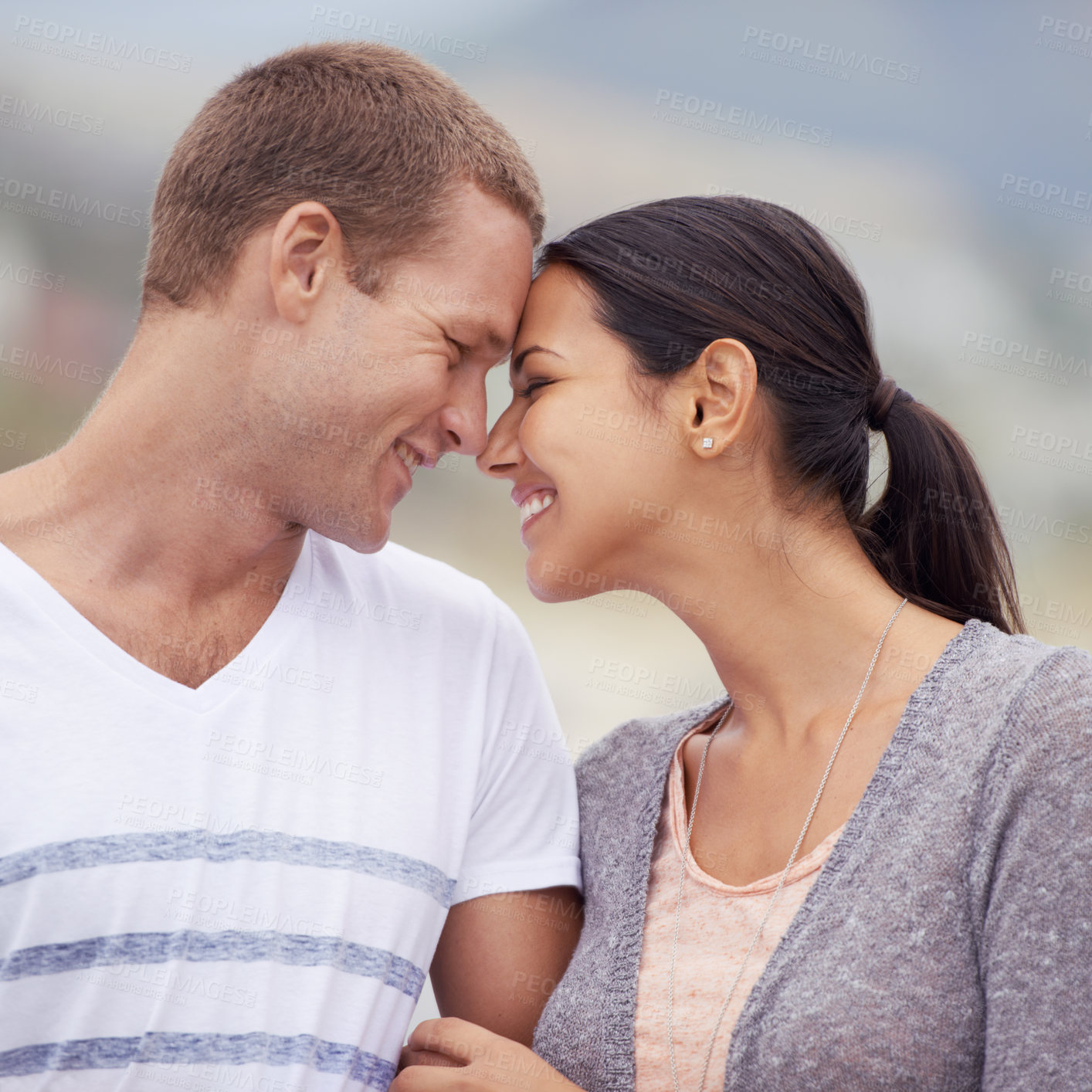 Buy stock photo Couple, affection and happy in outdoor with bonding for honeymoon, love and relax for leisure. Closeup, relationship and smile on break for date with support, forehead touch and care for trust. 