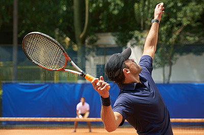 Buy stock photo Fitness, sports and tennis with man serving on court to start match for competition or game from back. Exercise, health or training and man with racket at stadium or venue for beginning of tournament