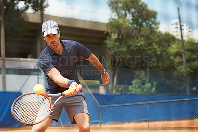 Buy stock photo Fitness, sports or tennis and man with racket hitting ball on court for competition, game or match. Exercise, health and training with confident young athlete person outdoor in summer for action