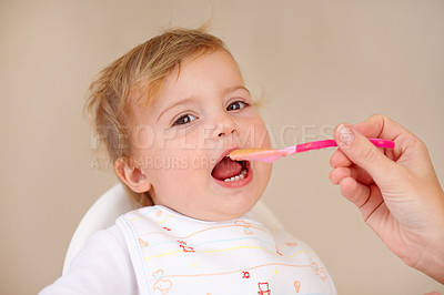 Buy stock photo Spoon, baby girl and chair for eating food for nutrition, growth and development. Young child, happy and excited for feeding breakfast or meal and snack for wellbeing or hungry in morning or home