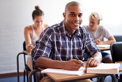 Buy stock photo Black man, portrait and student with book in classroom for studying, reading or writing summary at university. African male person or academic writer with smile for assignment, test or exam at campus