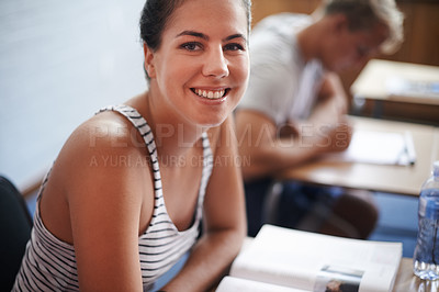 Buy stock photo College student, portrait and desk in classroom with books for english literature or language for exam. Female person, university and scholarship for learning or education, knowledge and studying.