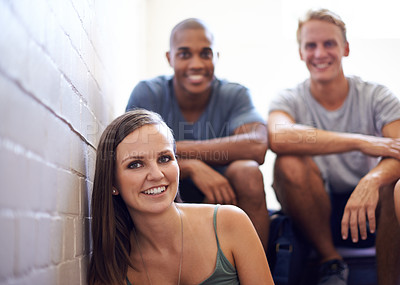 Buy stock photo Portrait, students and smile in college stairs, relaxing or resting and happiness for break. People, men and woman in university diversity or group, friends and sitting on campus before class