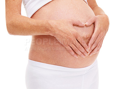 Buy stock photo Woman, hands and heart with pregnancy in studio on white background for care, love and wellness for health. Closeup, female person and mother with maternity for childbirth and future family. 