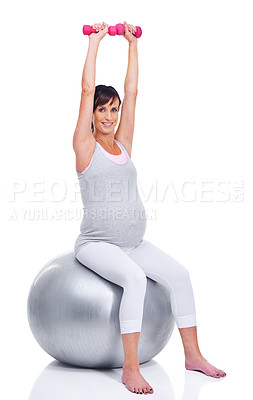 Buy stock photo A pregnant mother smiling with a pilates ball while isolated on white