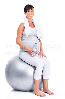 Buy stock photo Pregnant female person, fitness and ball for studio, wellness and exercise for motherhood in pregnancy. Maternal woman, water and white background for health, maternity and towel to keep in shape 