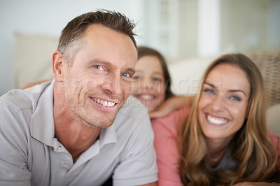 Buy stock photo A happy family spending an afternoon relaxing on a couch at home
