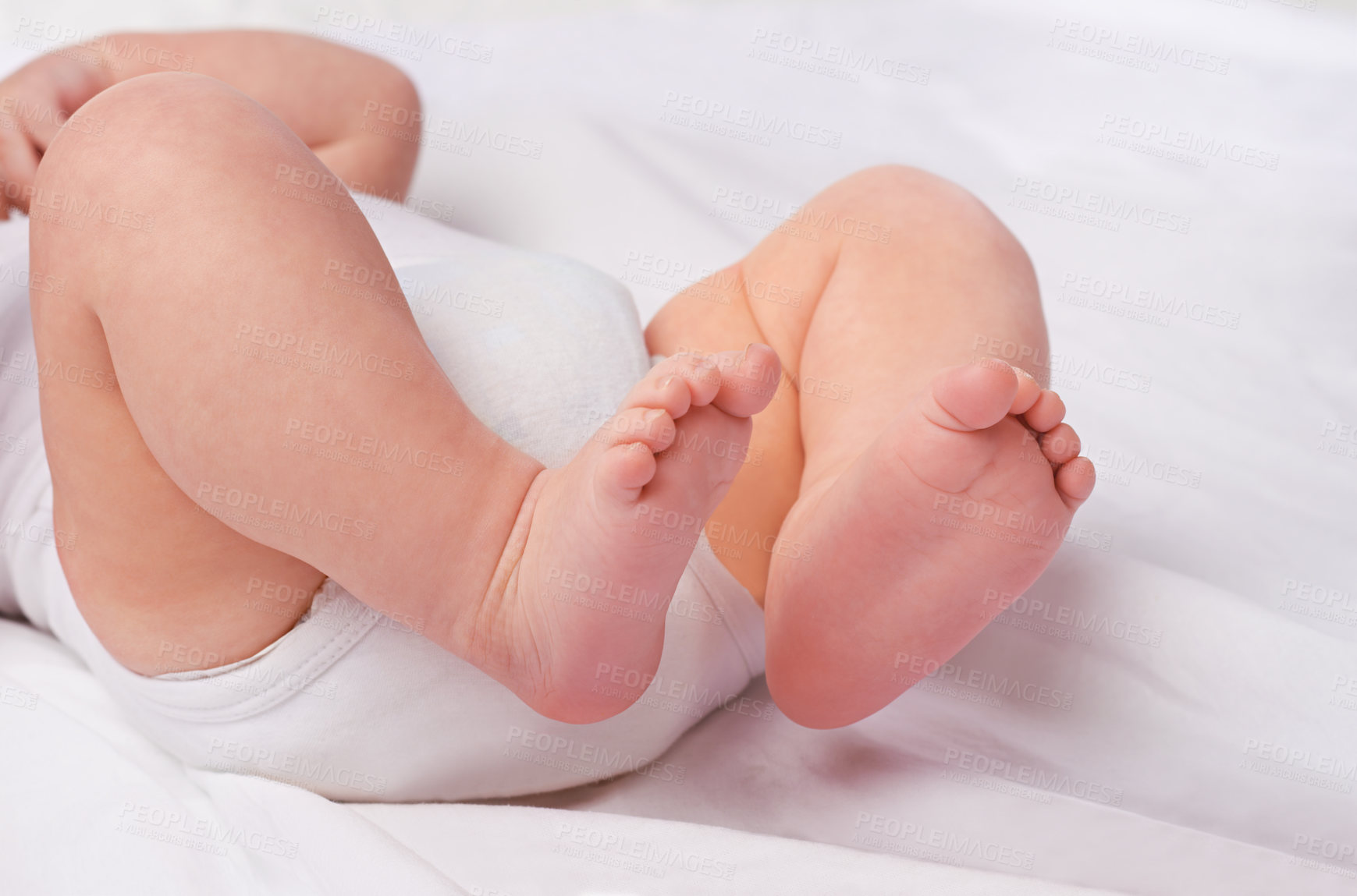 Buy stock photo Closeup, newborn baby or feet for relax, bed and nap for healthy childhood, care and development. Bare foot, leg and toes of young child for calm, rest and sleeping in peaceful nursery for dreaming