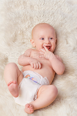 Buy stock photo Happy baby, diaper and laugh in bedroom, furry blanket and playtime in cute for child development. Infant, kid and wellness for playing, adorable and positive on rug in house for home and toddler fun