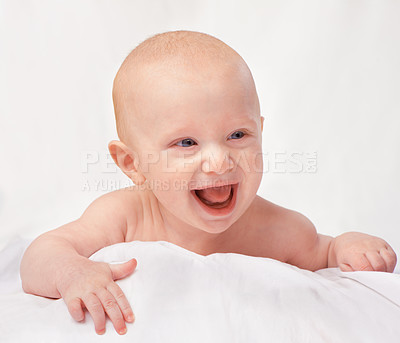 Buy stock photo Cropped shot of an adorable baby boy in a studio