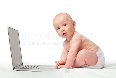 Buy stock photo Studio shot of a baby boy sitting with a laptop