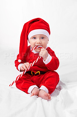 Buy stock photo Studio shot of a little boy dressed up in a santa costume