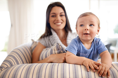 Buy stock photo Mother, baby and relax in portrait on couch, care and support or smile in living room and comfortable. Mommy, son and love for bonding in childhood, single parent and happy for childcare on weekend