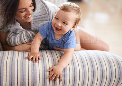 Buy stock photo Mother, smile or baby in home for playing, happiness and bonding in a family house in living room. Relax, boy and toddler laughing with mom, love or care for child development, wellness or growth