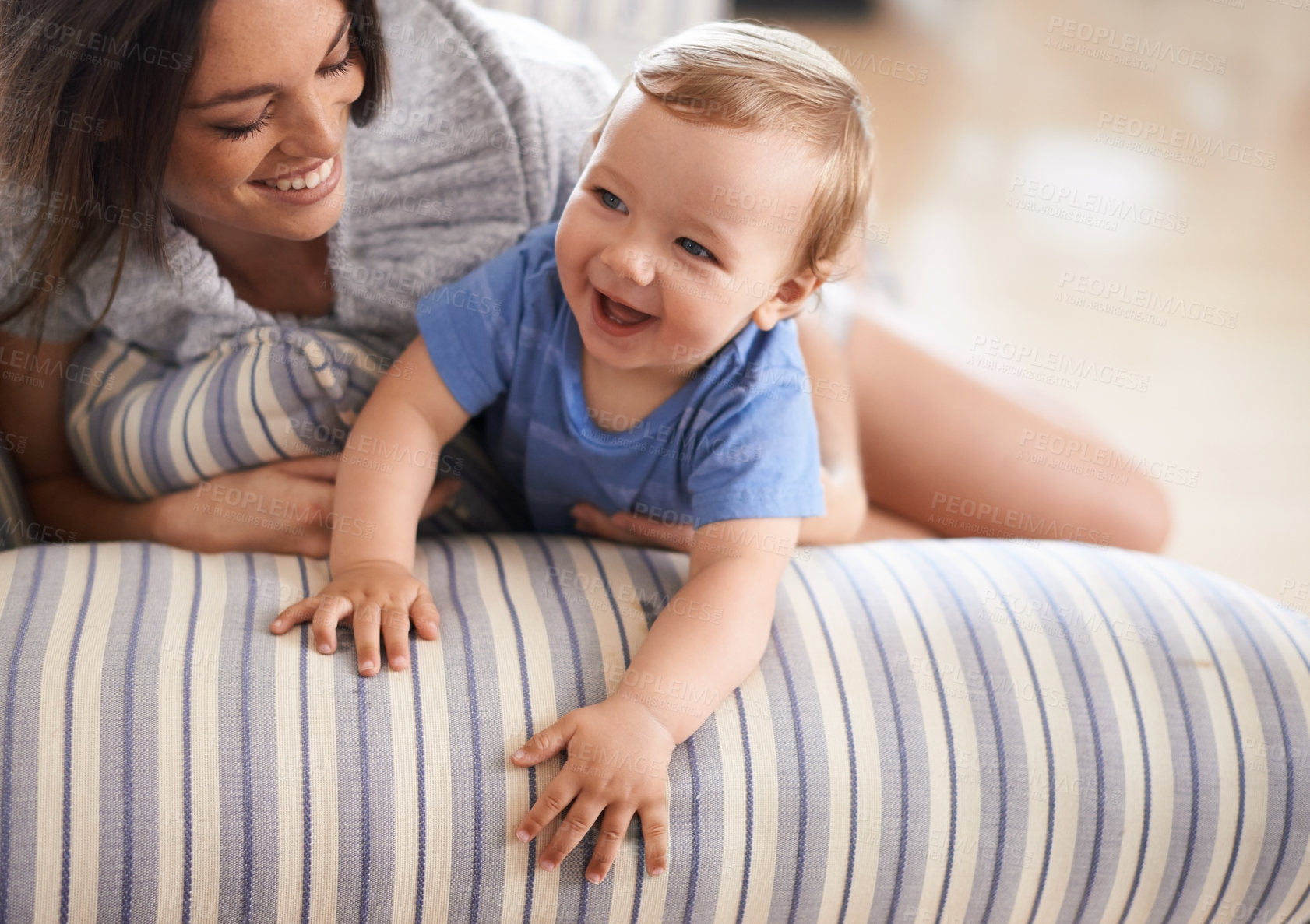 Buy stock photo Mother, smile or baby in home for playing, happiness and bonding in a family house in living room. Relax, boy and toddler laughing with mom, love or care for child development, wellness or growth