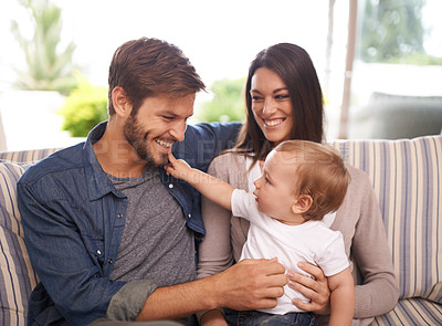 Buy stock photo Parents playing, happy family and baby in home for support, security or bonding in living room. Smile, boy and toddler with mom or father for love or care for child development, wellness or growth