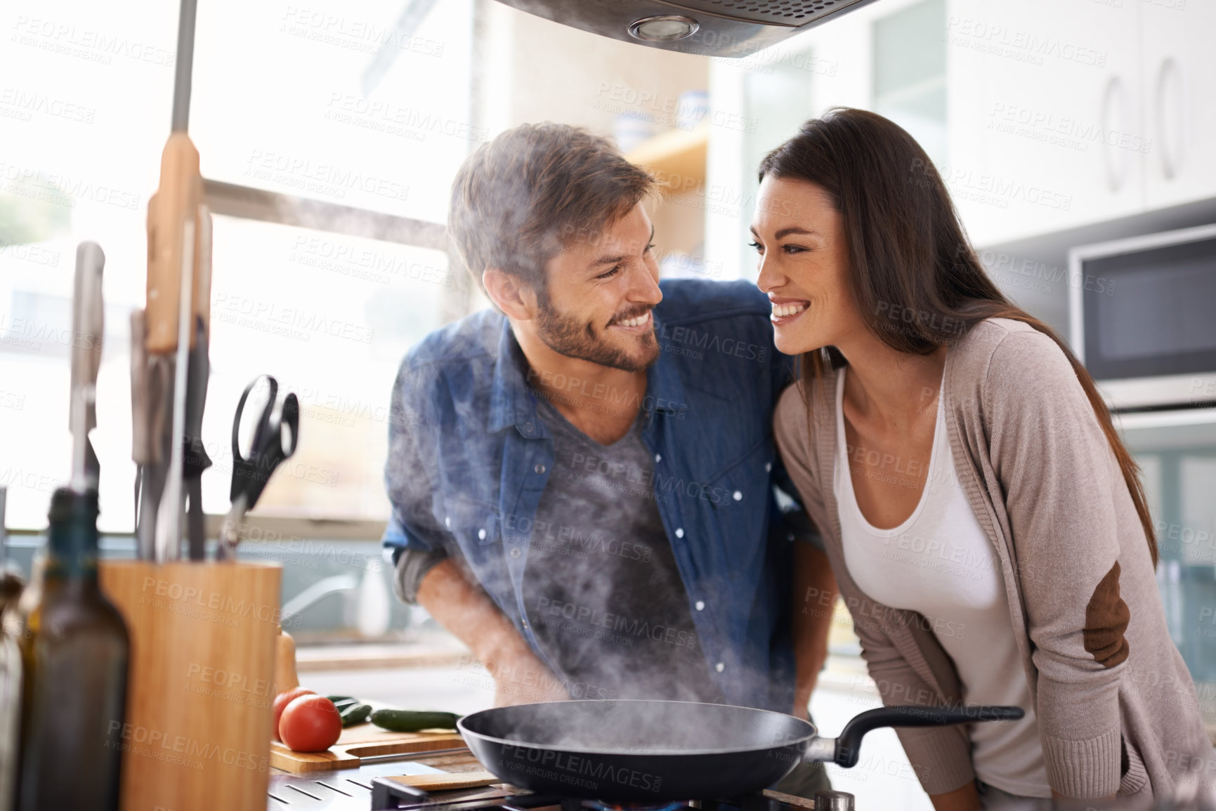 Buy stock photo Food, love and happy couple in kitchen cooking, smile and preparing lunch in their home together. Dinner, date and man with woman excited, hungry and cheerful for meal preparation in their apartment