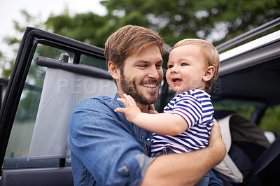 Buy stock photo Father, baby and care in embrace, outdoors and support or relax in nature and single parent. Daddy, son and affection for bonding in childhood, happy and security in hug or smile on face in nature