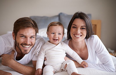 Buy stock photo Portrait, smile or parents with baby in home, love or bonding together for child growth or development. Happy family, dad or mom with pride face for newborn responsibility or natural care in bedroom