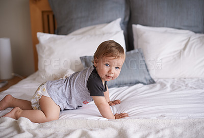 Buy stock photo Boy, baby and crawl on bed in portrait, joy and kid for motor skills in bedroom on weekend. Child development, happy toddler and calm or comfortable, wellness and learn for health and positive growth