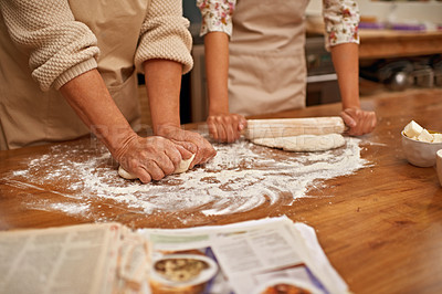 Buy stock photo Dough, recipe and hands of people on table, baking in kitchen and closeup on process in bakery. Person, prepare and press bread with flour, meal prep and working with information or guide from book