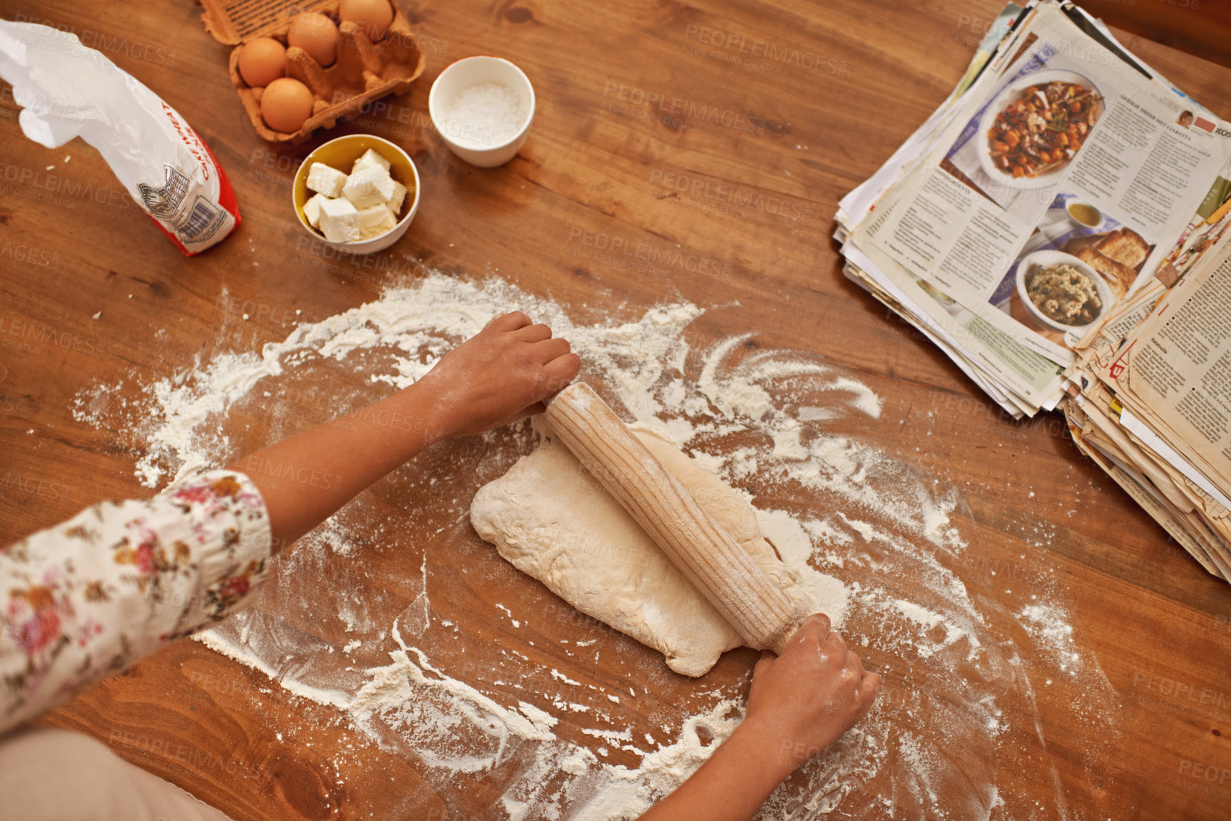 Buy stock photo Dough, recipe and hands with rolling pin on table, above baking in kitchen and closeup on process in bakery. Person, prepare and press bread with flour and meal prep with information guide in book