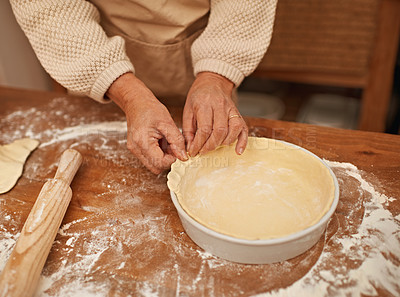 Buy stock photo A cropped view of hands working the dough while baking in a kitchen