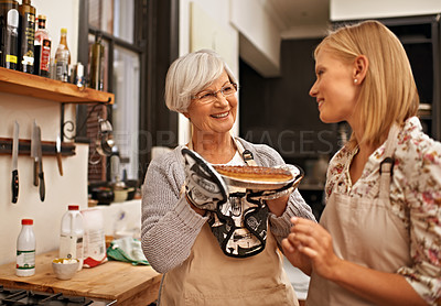 Buy stock photo Family, smile and senior mother baking with daughter in kitchen of home together for pastry preparation. Food, cooking or pie with happy parent and woman in apartment looking proud of recipe