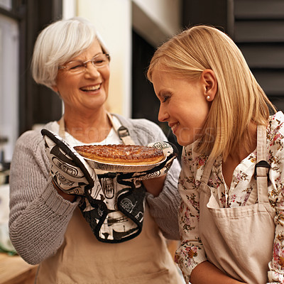Buy stock photo Family, smelling and senior mother baking with daughter in kitchen of home together for pastry preparation. Food, cooking or meal with happy parent and woman in apartment fresh baked pie aroma