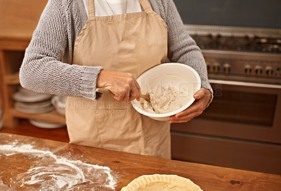 Buy stock photo Hands, baking and mixing bowl with woman in kitchen of home to stir ingredients for culinary recipe. Cooking, food and preparation with senior person in apartment as chef for pastry preparation