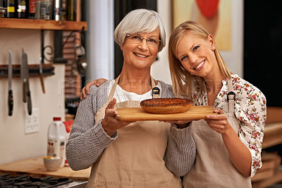 Buy stock photo Portrait, happy woman and senior mother with pie in home, cooking or smile of family showing homemade food together in kitchen. Face, daughter and elderly mom with dessert, pastry or help with baking
