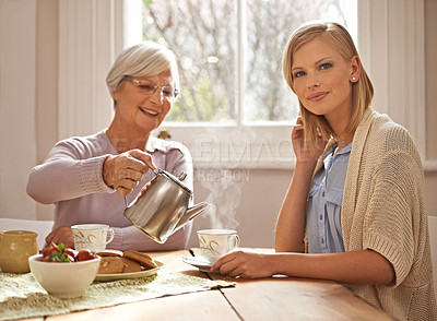 Buy stock photo Home, portrait and woman with grandmother for tea at brunch for bonding or visit in retirement. Senior, grandma and coffee break with food, conversation and pouring liquid with steam in morning