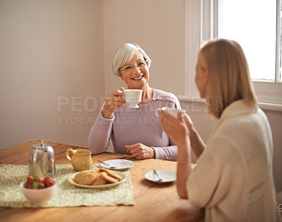 Buy stock photo Happy, grandmother and tea in home with woman at brunch bonding on visit in retirement. Senior, grandma and girl on coffee break with food, conversation and relax on holiday or vacation in morning