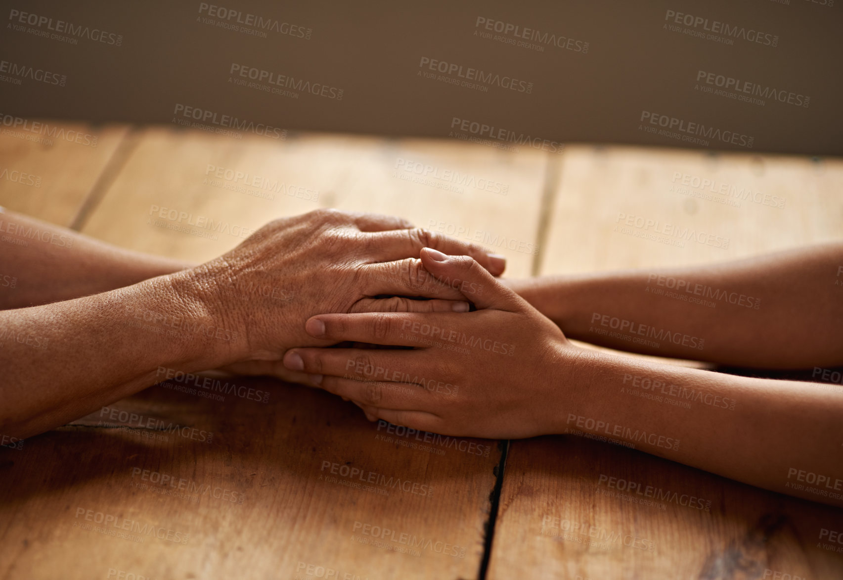 Buy stock photo Support, unity and closeup of people holding hands for grief, hope and sympathy after loss. Gratitude, empathy and friends in an intimate moment with affection for love, trust and solidarity on table