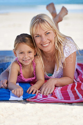 Buy stock photo Portrait, mother and happy kid at beach to relax on holiday, summer or vacation on blanket. Face, mom and smile of girl at ocean for adventure, travel or family bonding together outdoor in nature