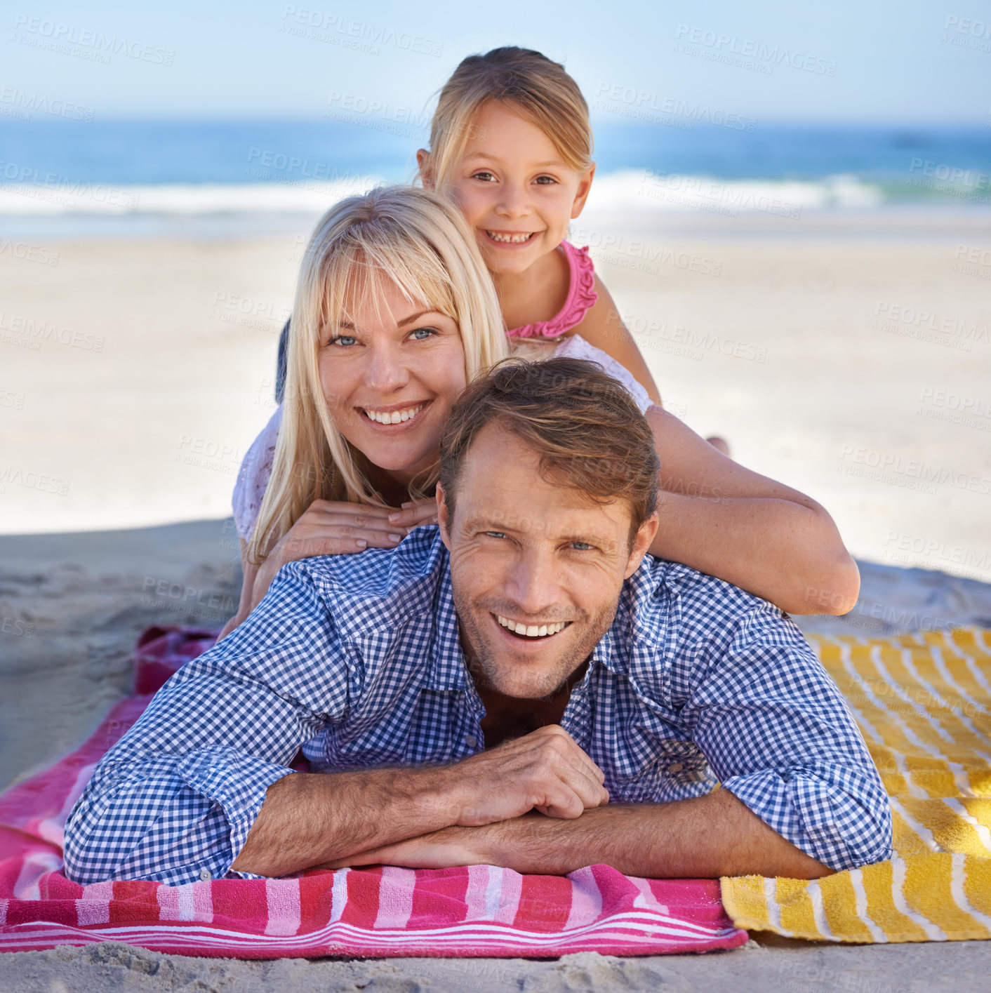 Buy stock photo Portrait of a happy young family at the beach