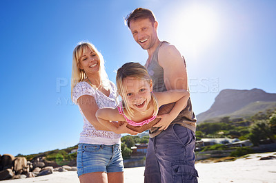 Buy stock photo Parents, swing and playing with girl at beach in portrait with care, love and bonding in summer on holiday. Father, mother and daughter with games, connection and seaside with sunshine on vacation