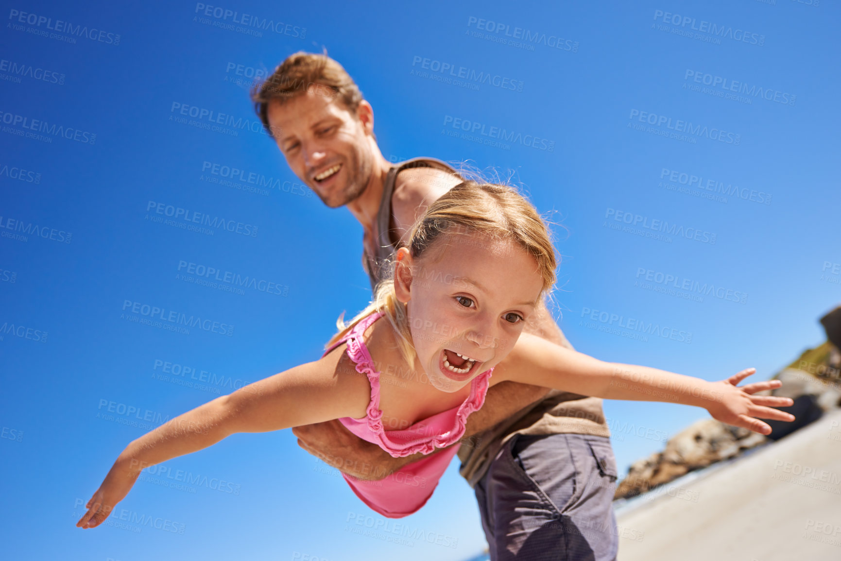 Buy stock photo Happy dad, beach and flying with child for fun summer, holiday or outdoor weekend together in nature. Father, little girl or playing with daughter for freedom in sun by the ocean coast with blue sky