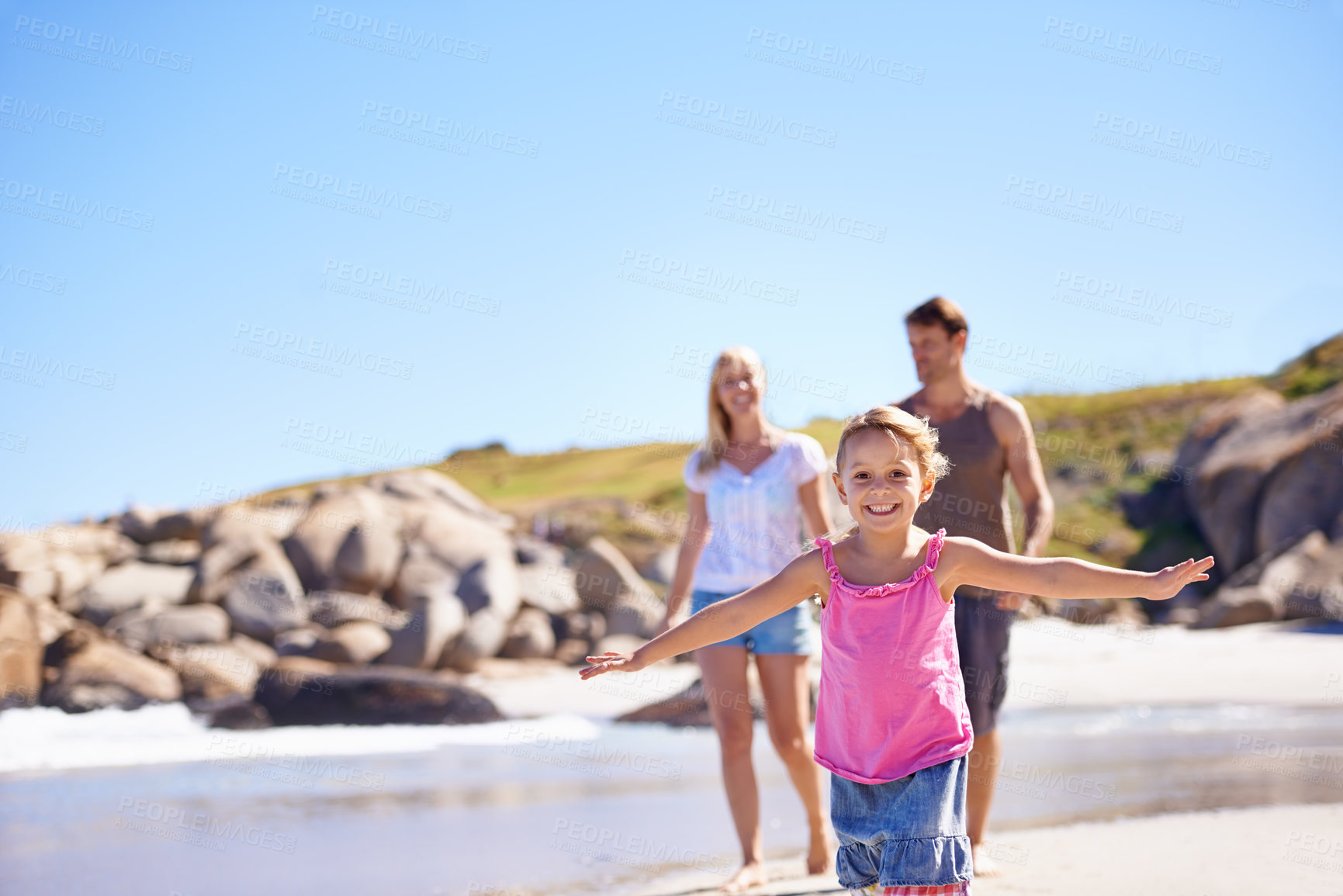 Buy stock photo Young girl, family and beach for holiday, play and dreaming   of flying for fun. Parents, sea side and ocean on summer season vacation in Hawaii, smile and excited daughter in beach wear in sunshine 