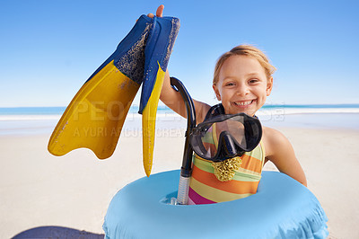 Buy stock photo Beach, portrait and girl child with flippers, snorkel and inflatable swimming ring on ocean background. Face, happy and kid swimmer smiling, excited and ready for adventure while traveling in Miami