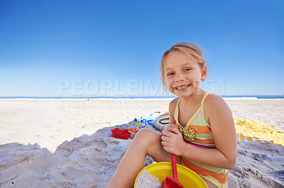 Buy stock photo Happy, portrait and little girl with beach toys for playful holiday, summer vacation or outdoor weekend. Female person, child or young kid playing with smile, bucket and spade on sand or mockup space