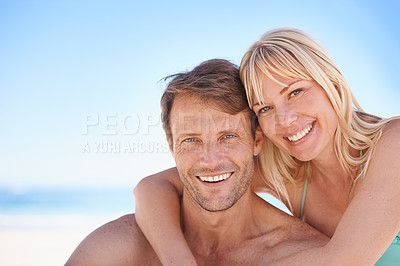 Buy stock photo Portrait, love and happy couple hug at a beach with support, gratitude and bonding in nature together. Travel, face and people embrace at the ocean for adventure, romance and summer, fun or holiday