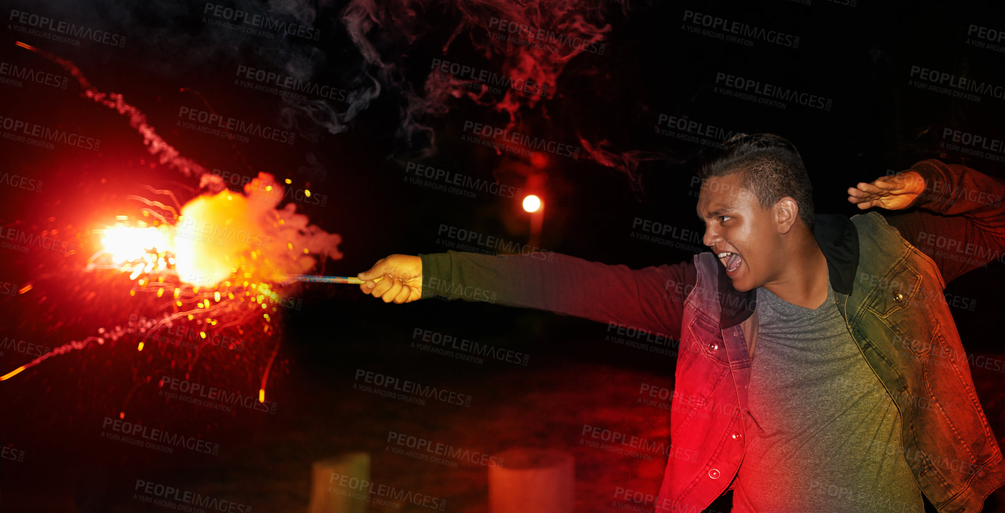 Buy stock photo Cropped shot of a teenage boy playing with a firework