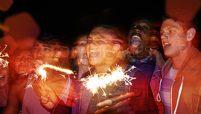 Buy stock photo Party, night and friends at festival with fireworks for Diwali, New Year or excited social event with sparkle. Celebration, lights and group of people with fire art, smoke and flare for happy crowd