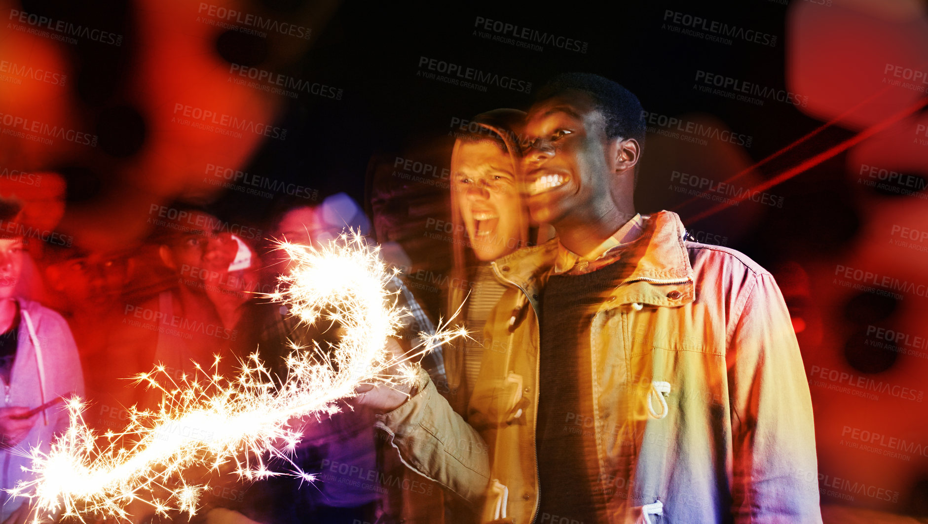 Buy stock photo Celebration, night and friends at festival with fireworks for concert, New Year or crowd at social event. Party, lights and group of people with fire art, smoke and flare with energy, fun and sparkle