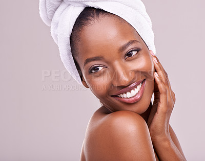 Buy stock photo Happy, woman and skin care with towel in studio for beauty, dermatology and thinking of benefits. Soft, facial and glow of young model or African person with smile for cosmetics on a white background