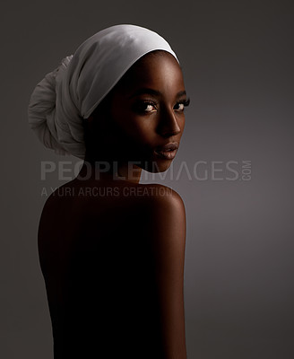Buy stock photo Portrait, beauty and culture with natural black woman in studio on gray background for wellness. Skincare, heritage and tradition with back of young person in headwear for cosmetics or dermatology